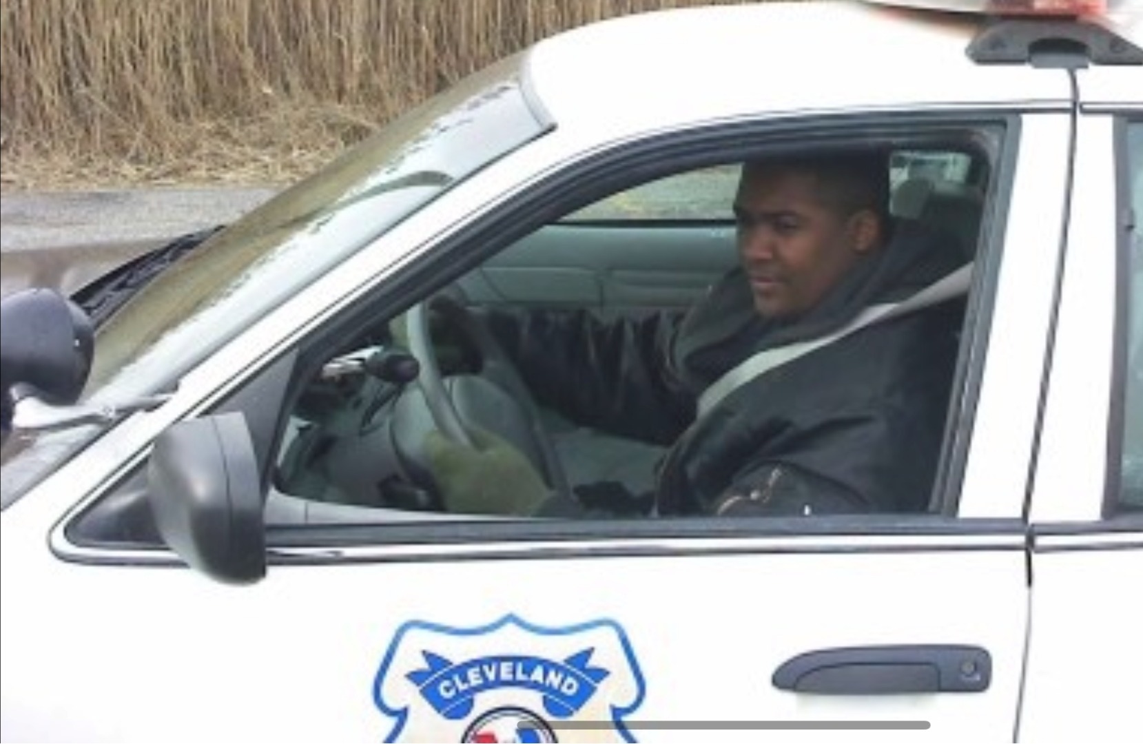A younger Anthony in a Cleveland Police cruiser.