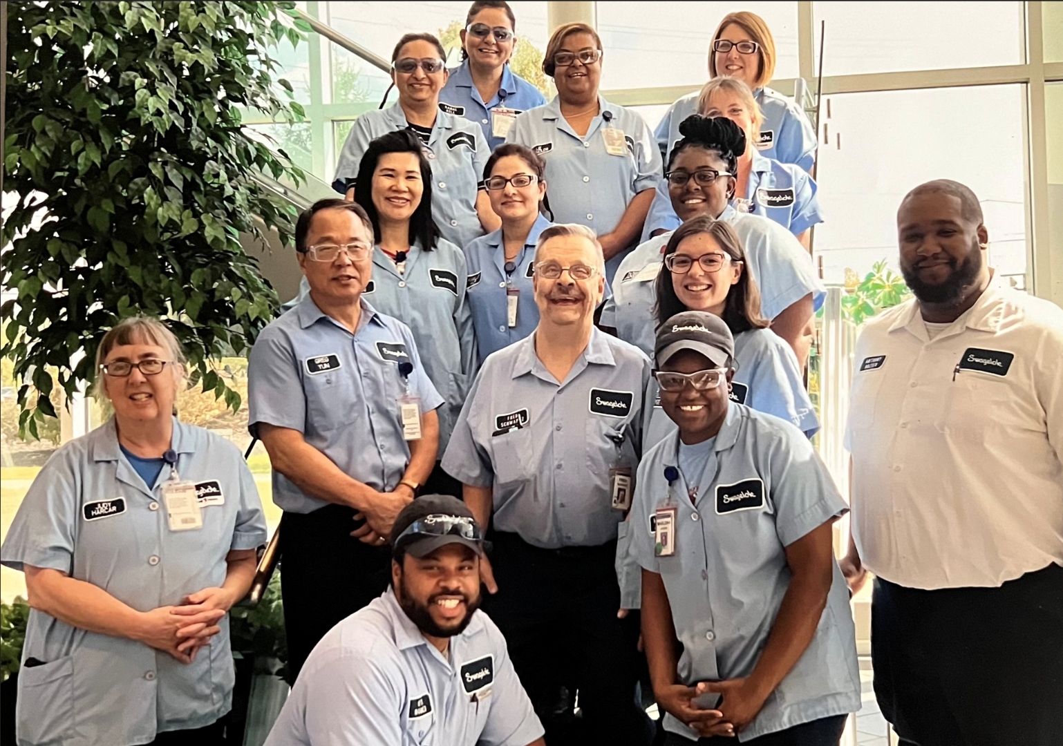 A team photo at Swagelok with team members in uniforms.
